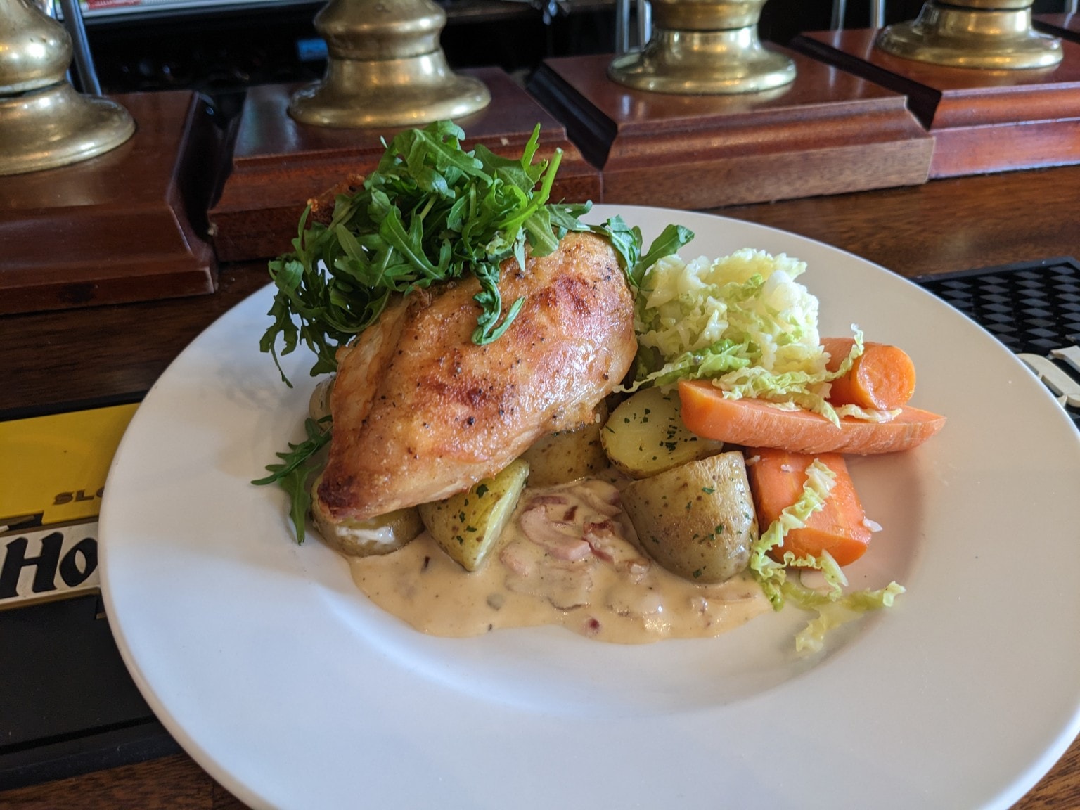 Roast chicken breast with potatoes, carrots and cream sauce