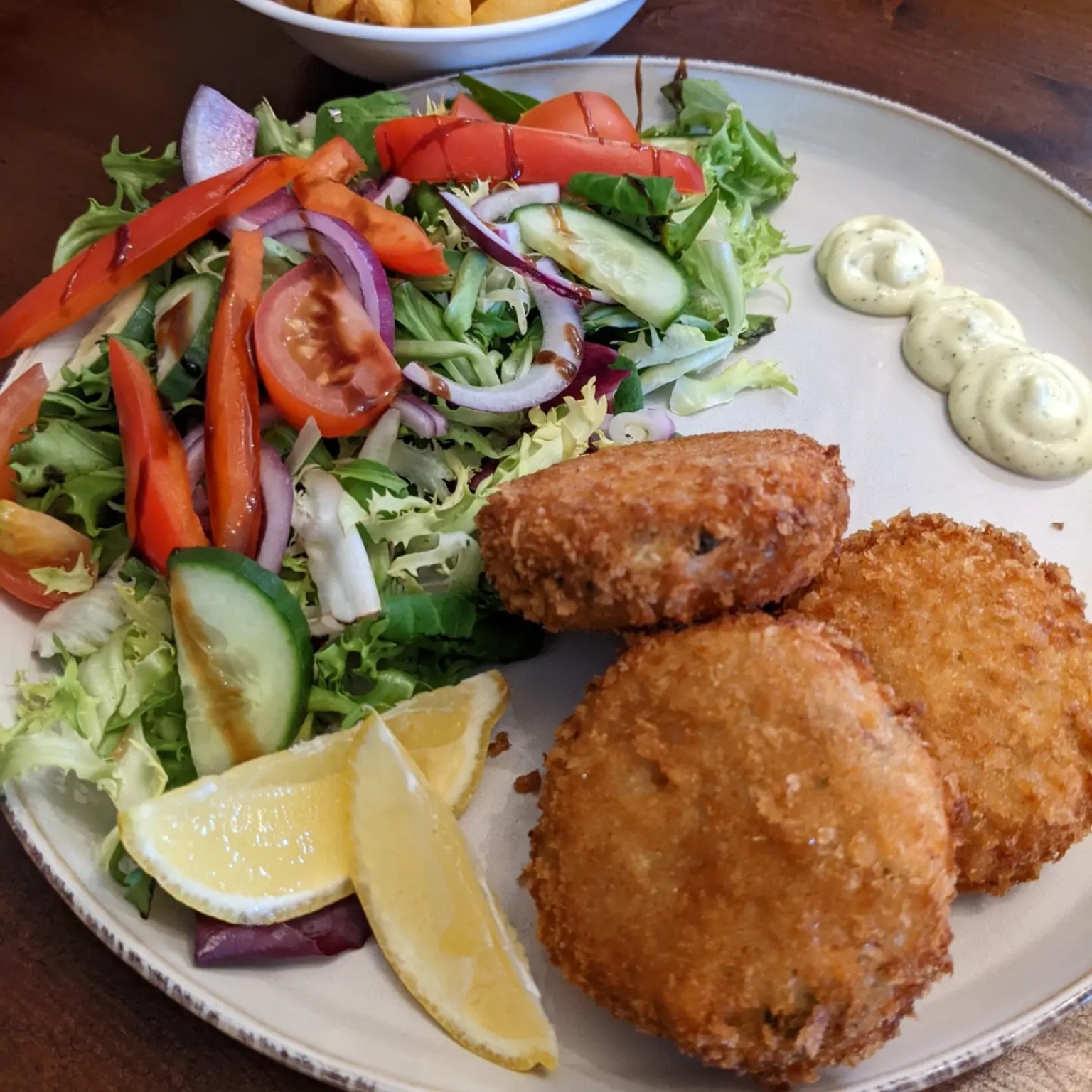 Homemade fishcakes with garden salad and tartare sauce