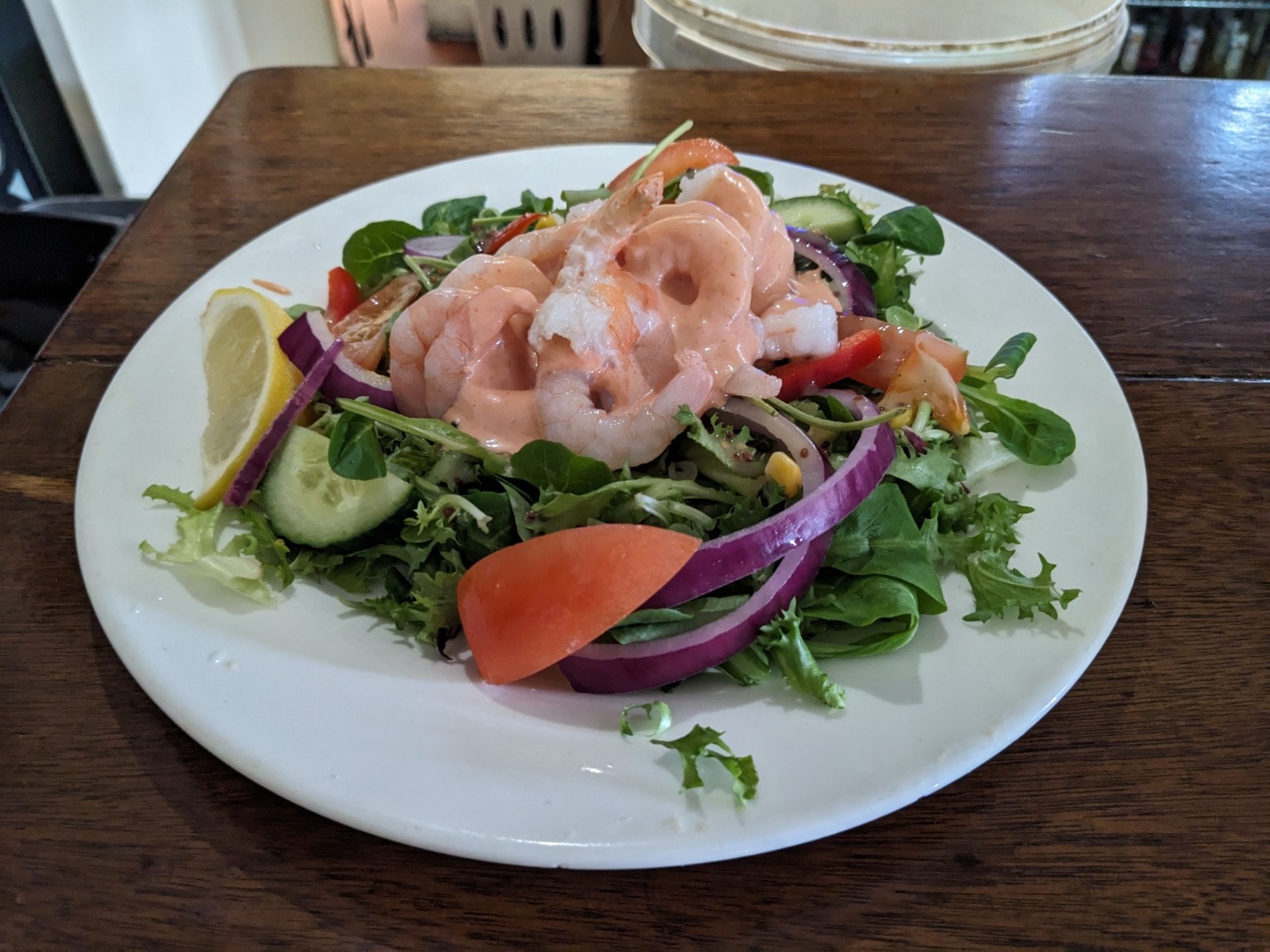 Prawn Marie Rose salad with mixed leaves and lemon